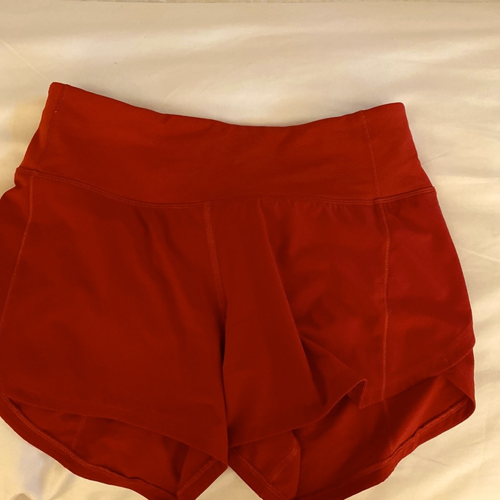 Red Lululemon mid rise 4 inch speed ups size 2